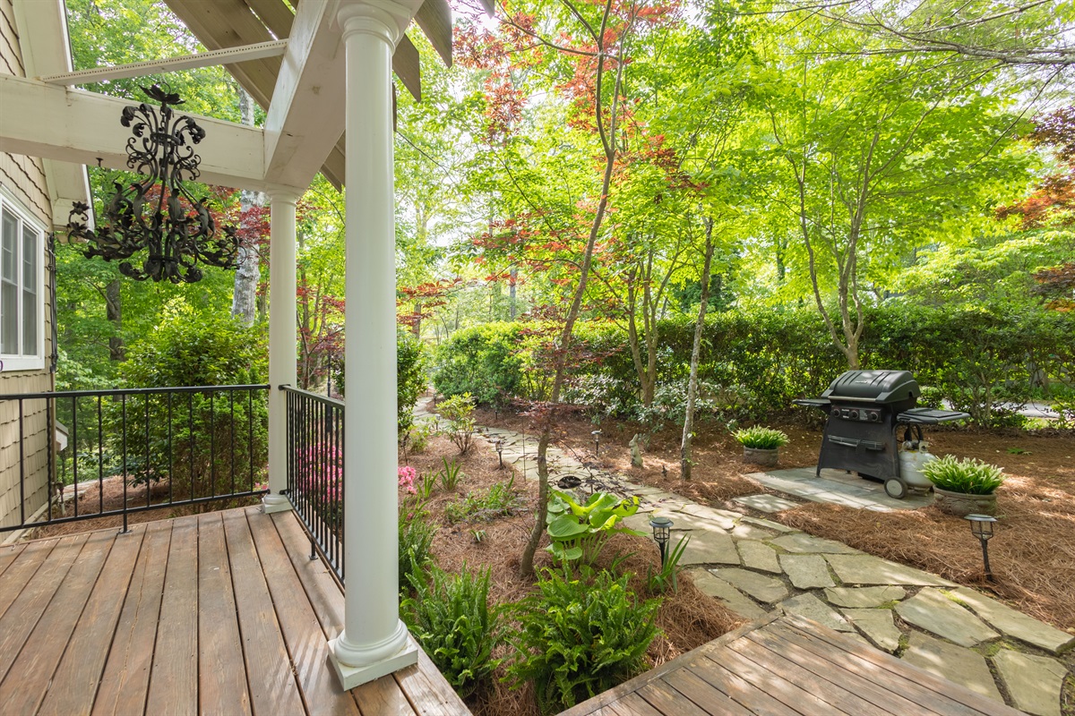 The covered porch and landscaped grounds provide a relaxing place to enjoy the fresh mountain air.