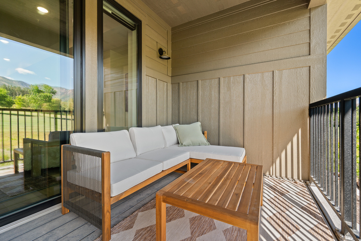 Comfortable outdoor seating area perfect for morning coffee or evening cocktails.