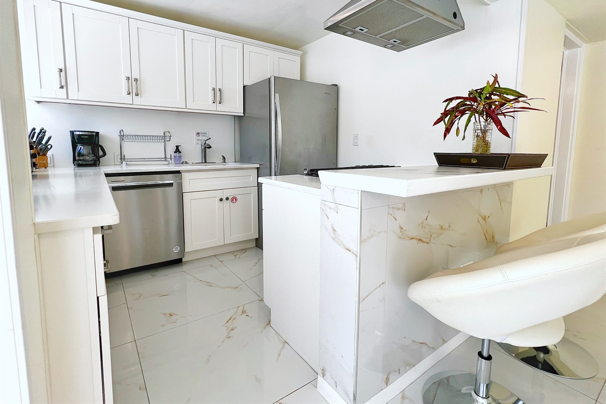 Spacious countertops and sleek design create the ultimate vacation kitchen.