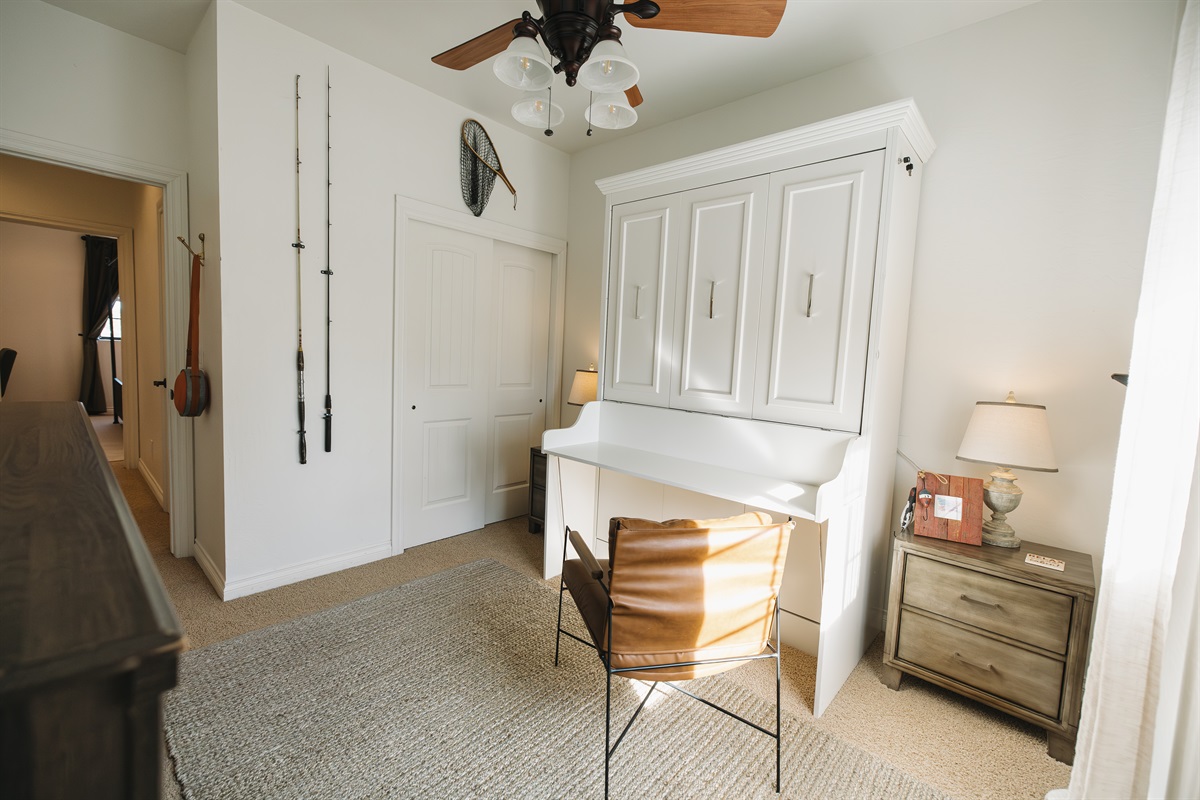 Bright bedroom retreat with dedicated workspace, ample storage, and warm natural light—ideal for remote work, unpacking comfortably, or enjoying a quiet mountain escape.