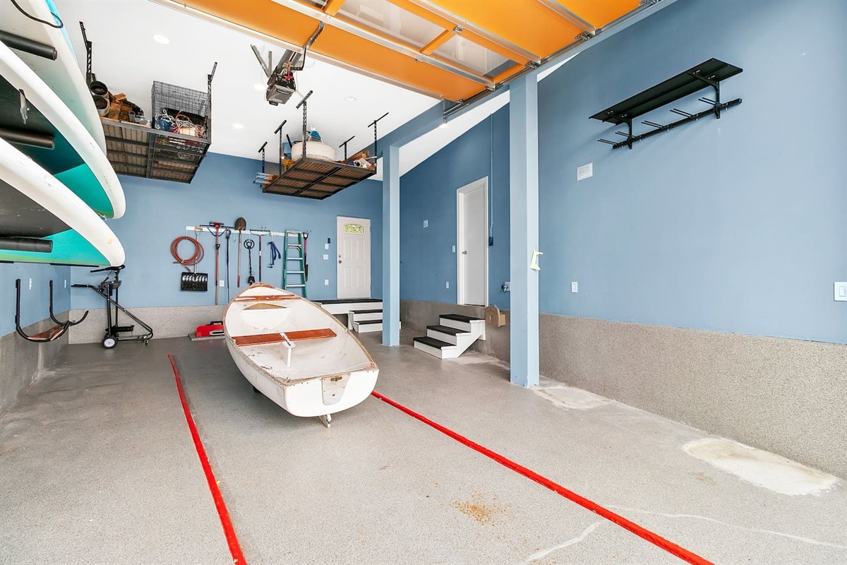 The boathouse is on the water with 3 paddleboards waiting for you to explore all the sound has to offer