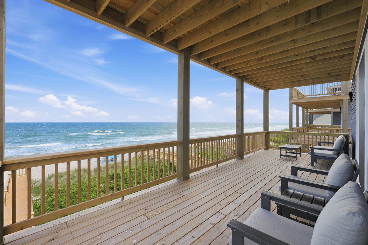 Covered oceanfront lounge deck with sectional seating