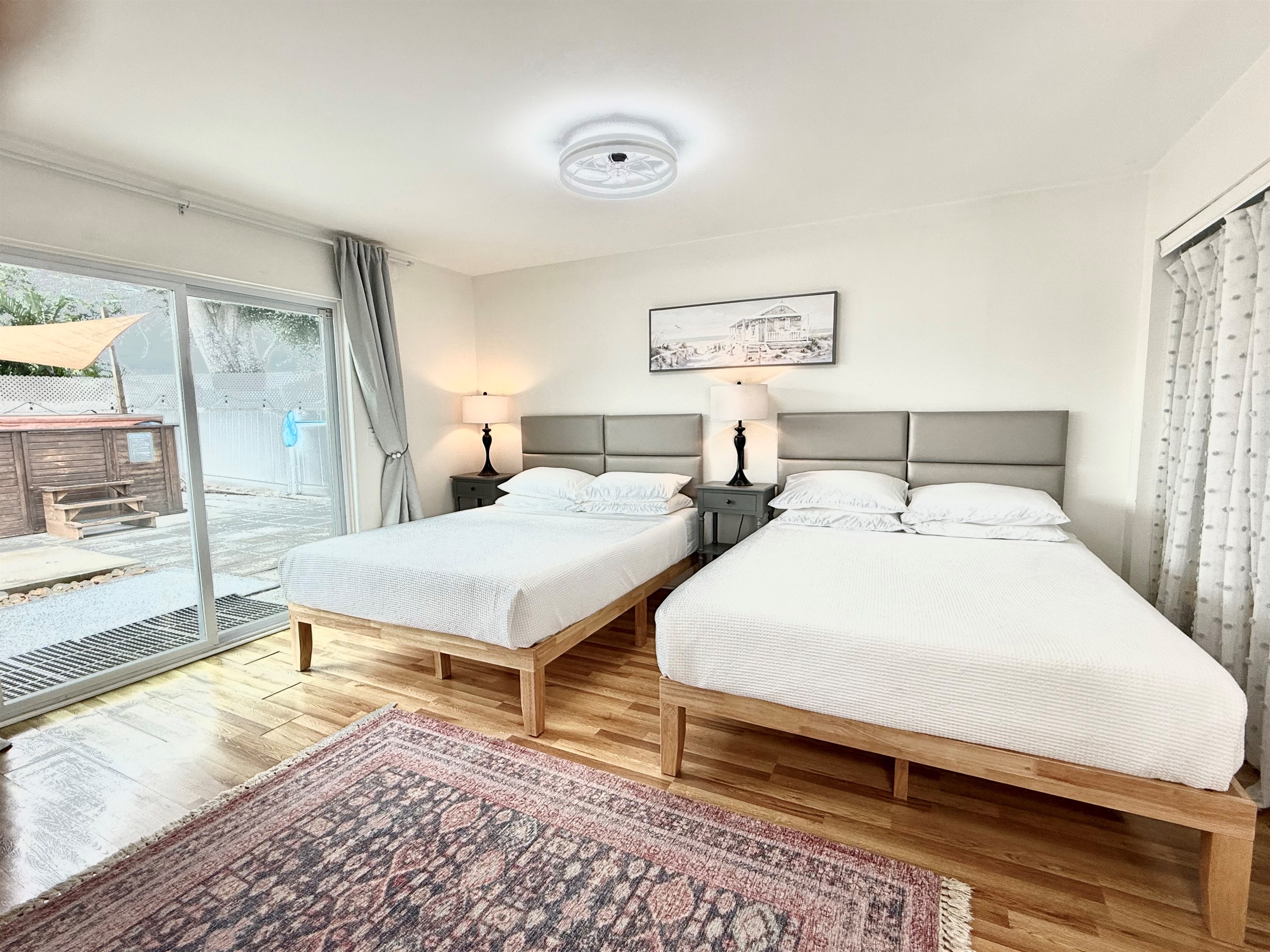 Master bedroom - 2 Queen size beds with memory foam mattresses and smart 65" TV.  En-suite (attached) bathroom.