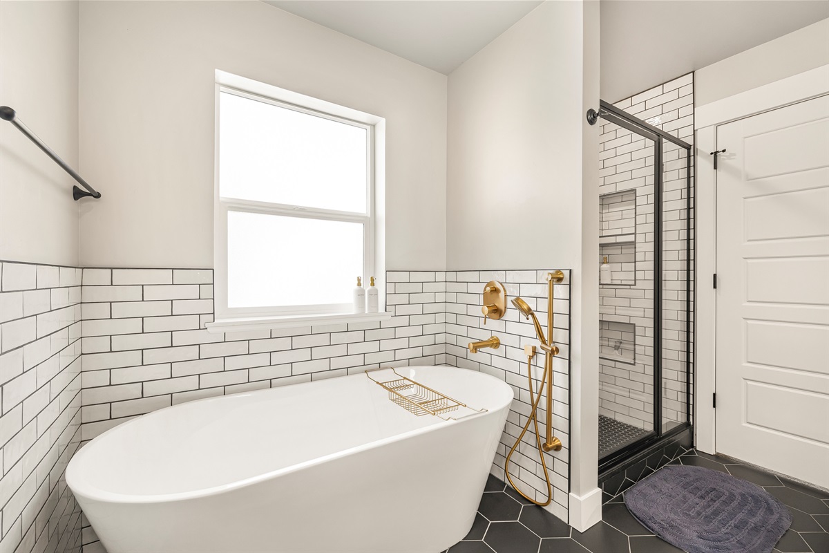 Master bathroom tub and walk in shower.