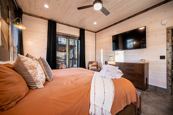 Thoughtfully designed king bedroom blending modern comfort with charming cabin vibes.