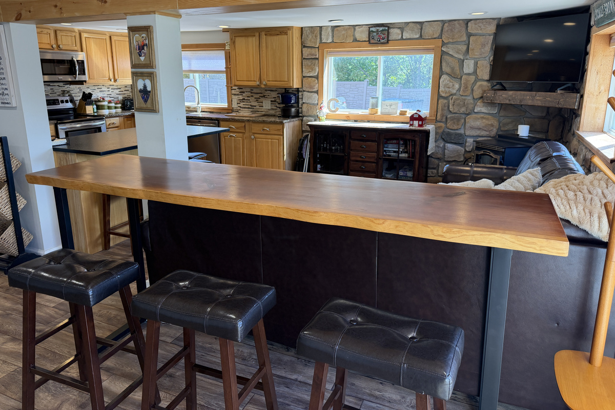 Bar seating behind the couch for snacking and cheering on your team