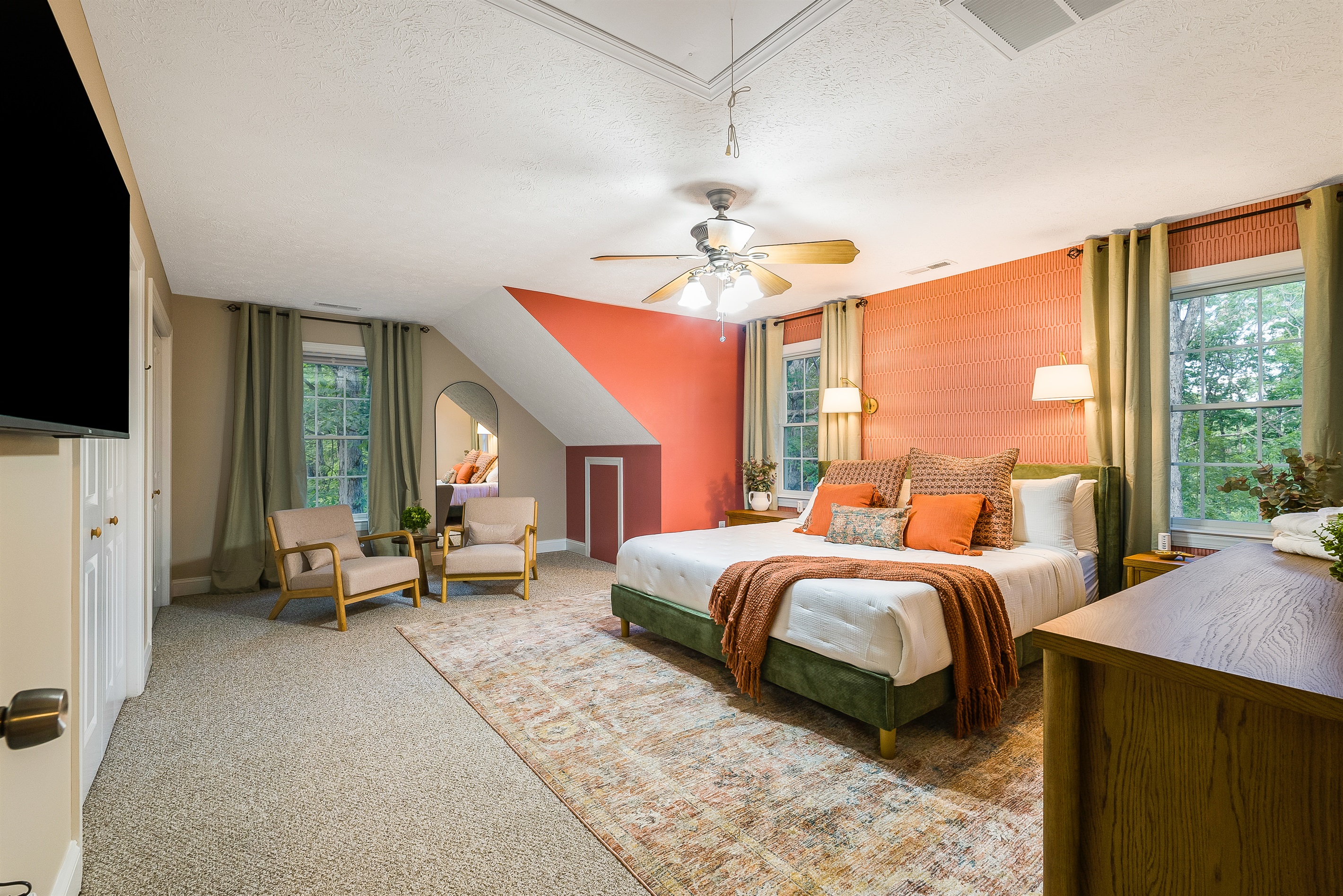 A cheerful king suite with vibrant accents, natural light, and inviting textures that brighten every morning.