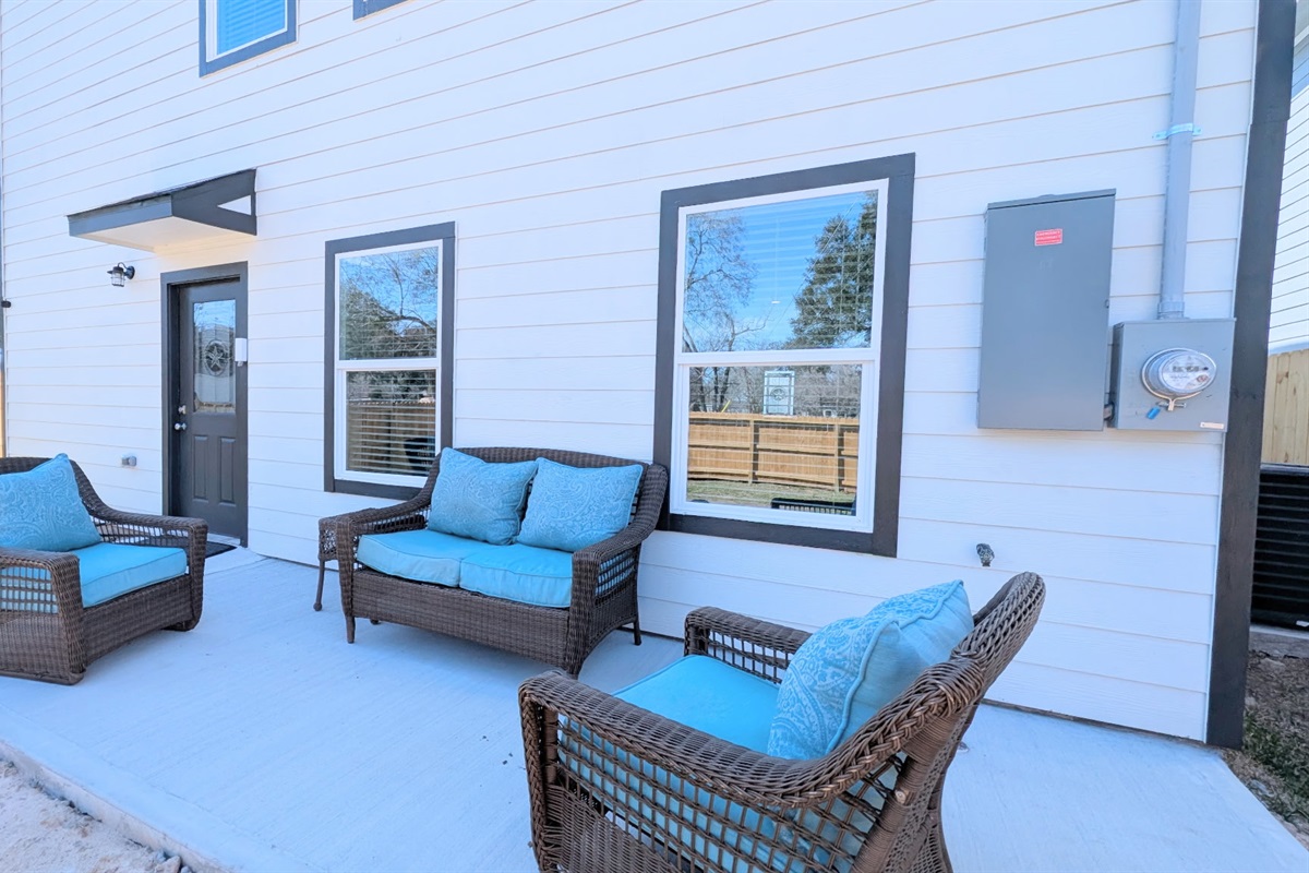Relax on the spacious back patio with fully fenced yard.