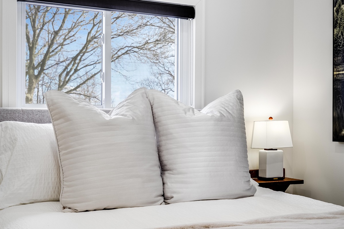 Wood shelving softens contemporary lines.