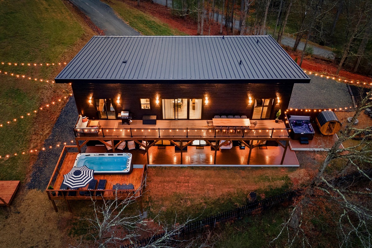 {Summit Exterior}
Set on 2 private acres bordering open farmland, the home offers rare privacy, wide-open views, and the occasional visit from cows along the fence line.