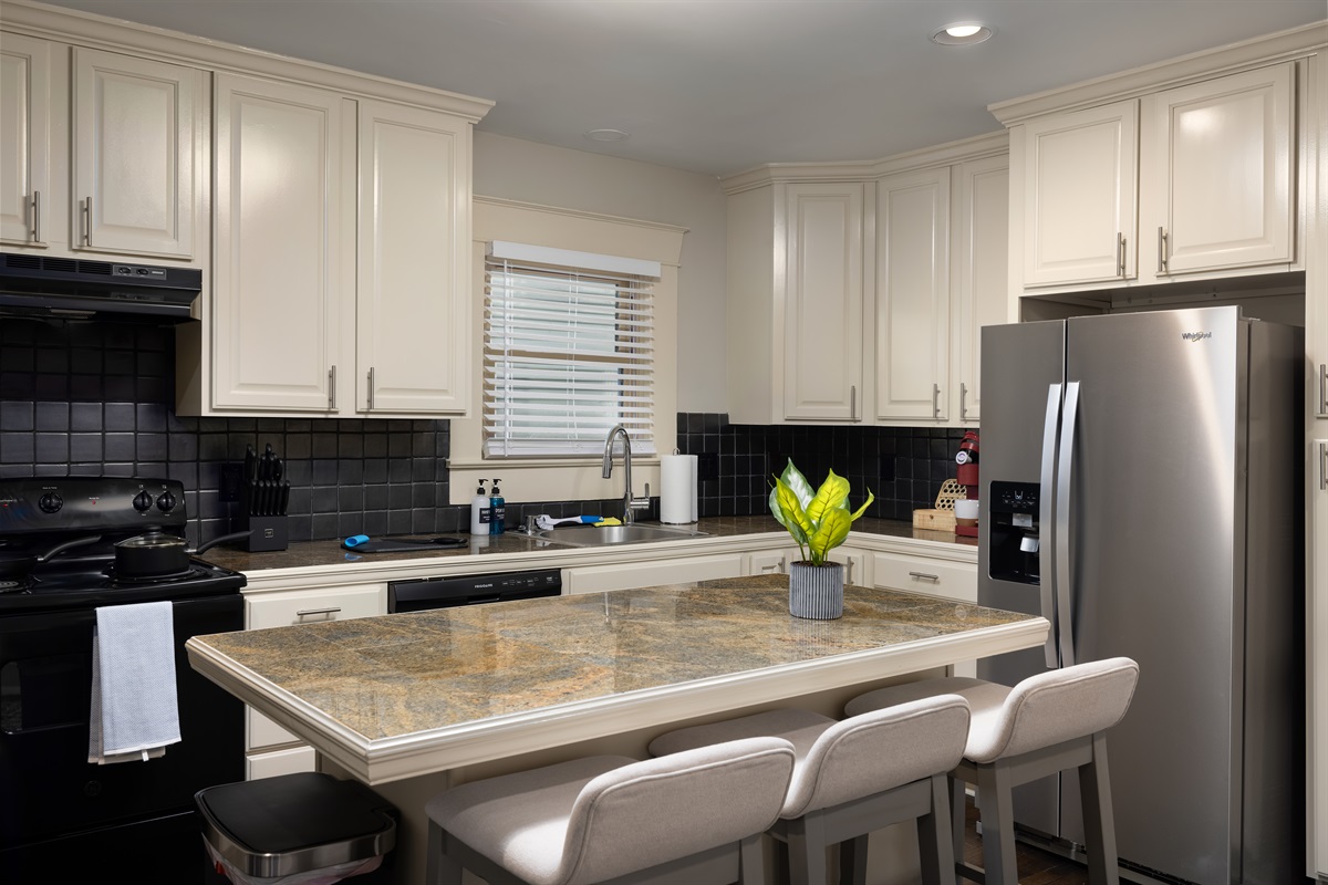 Savor your meals at our inviting kitchen bar dining space, designed for both style and comfort, where you can enjoy casual dining, morning coffees, or simply socialize over a quick bite.