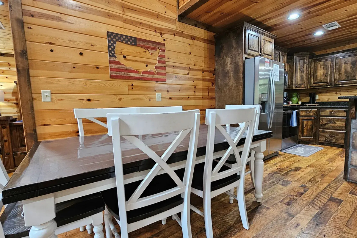 Gather here—rustic charm meets modern amenities in this inviting kitchen-dining space.
