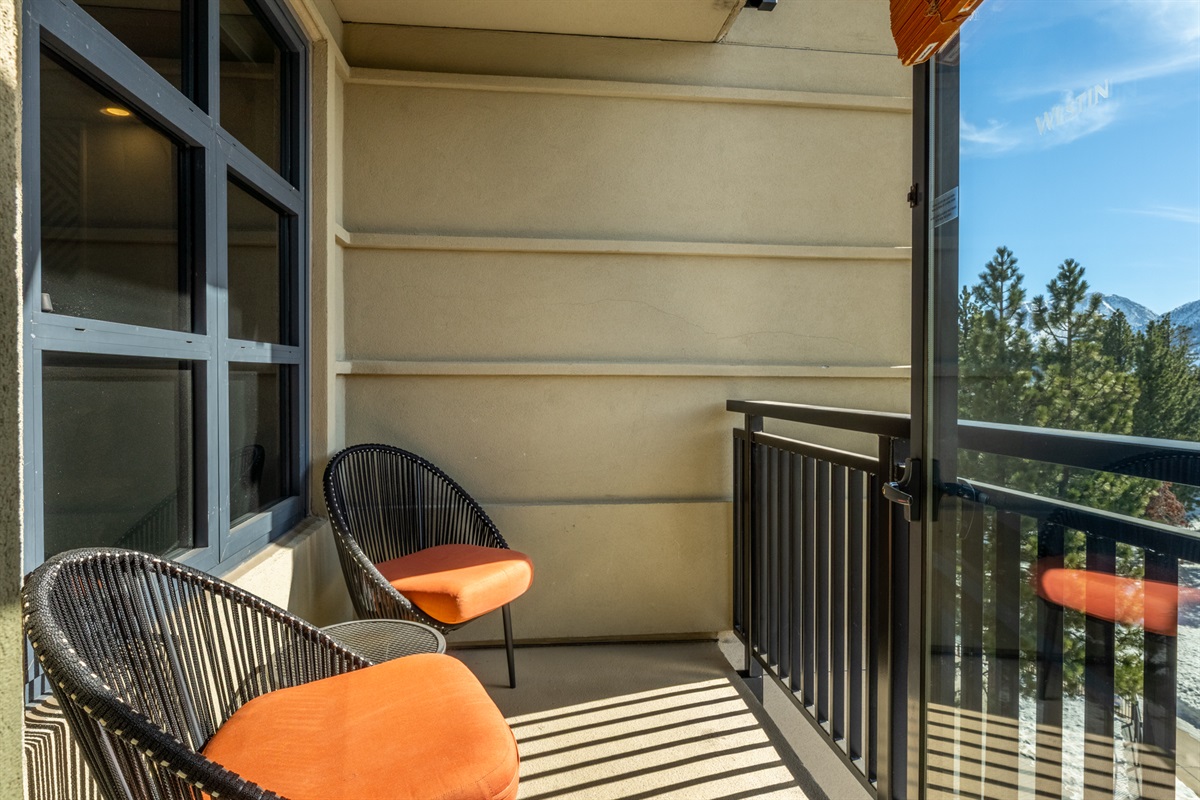 A private balcony with 2 cozy chairs and a small table offer fresh air, quiet moments, and a slower pace.