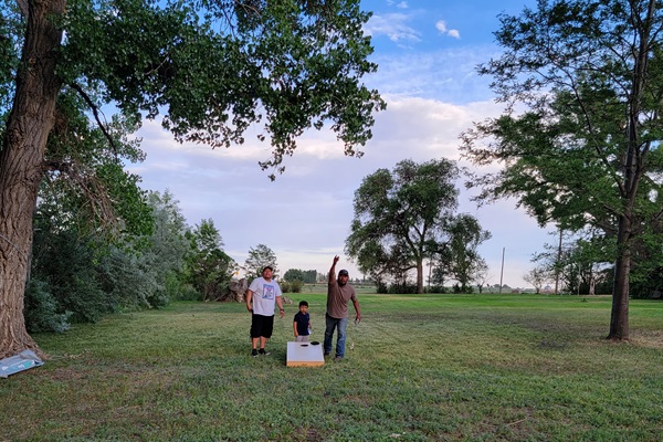 Laughter fills the air as friends and family gather together for games like corn hole, badminton, frisbee, even soccer!