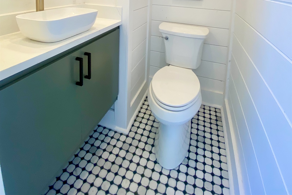 Hot tub towels can be found in the half bathroom cabinet, along with our vintage John Wayne and cowboy artwork. Legends!