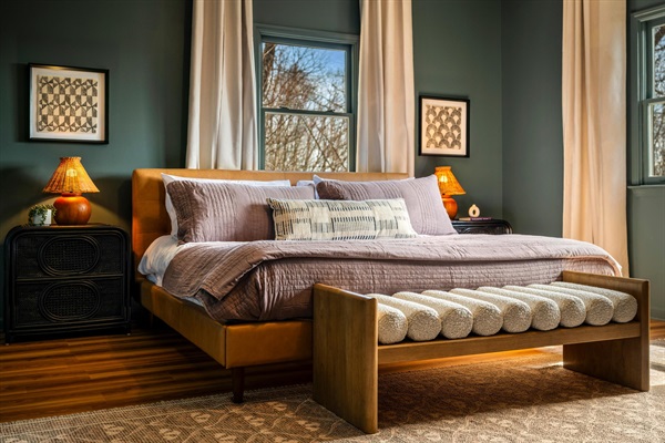 A spacious primary suite with mountain views, private bath, and a quiet office nook—your own place to unwind at the end of the day.