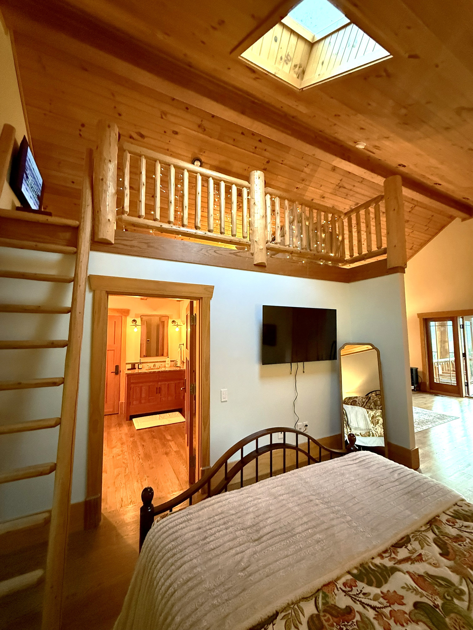 Apartment bedroom with queen bed and attached bathroom