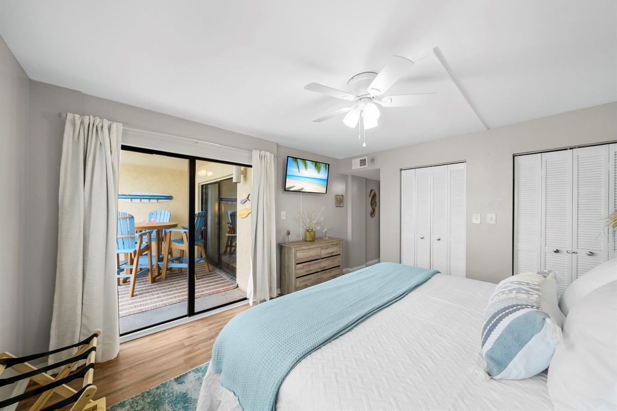 The master suite opens up onto the balcony where you can enjoy a brand new dining set