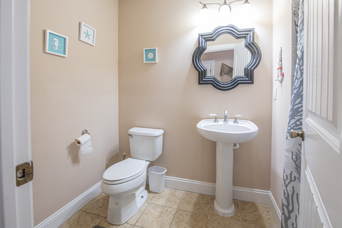 Bathroom 3 with Pedestal Sink and Decorative Mirror