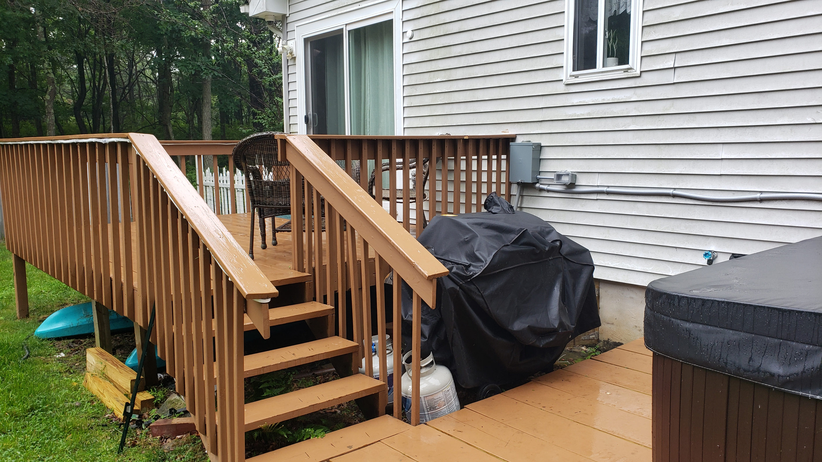 Back deck with seating; perfect for conversation or gathering. Gas Grill with Propane provided!