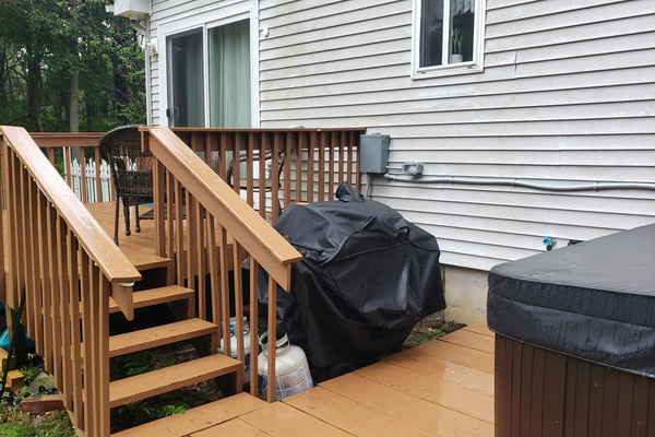 Back deck with seating; perfect for conversation or gathering. Gas Grill with Propane provided!