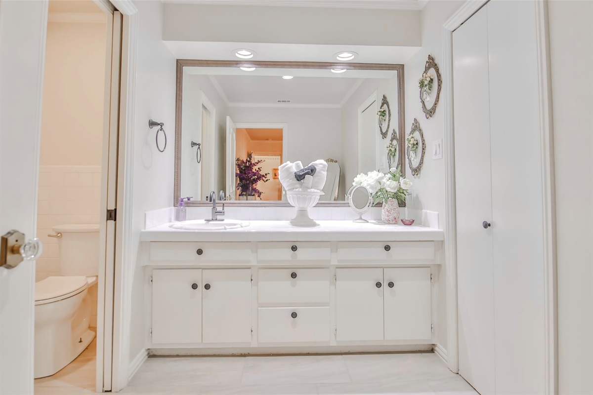 A shared bath, thoughtfully crafted to balance privacy with refined comfort—befitting guests of the highest esteem.