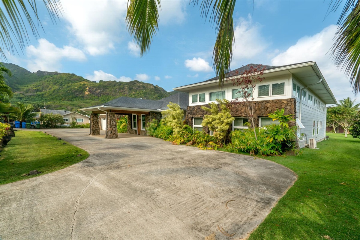 Spacious driveway accommodates multiple cars with ease