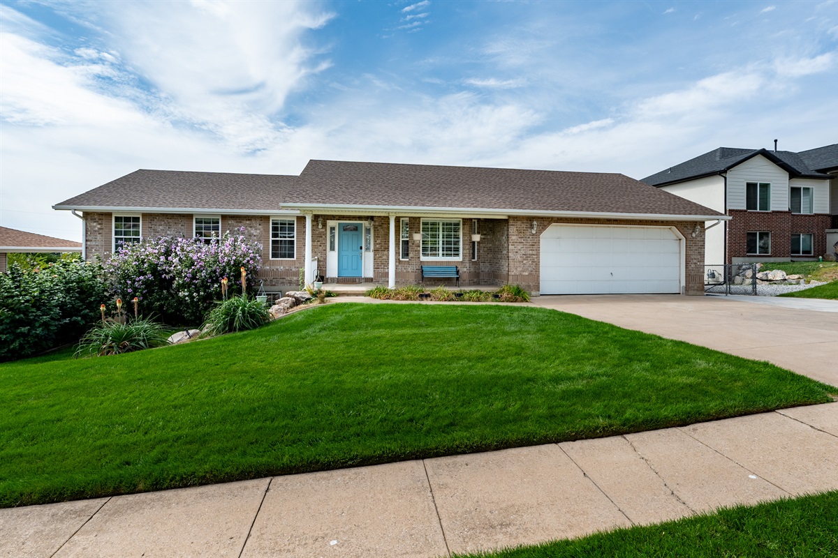 Beautiful curb appeal with manicured lawn