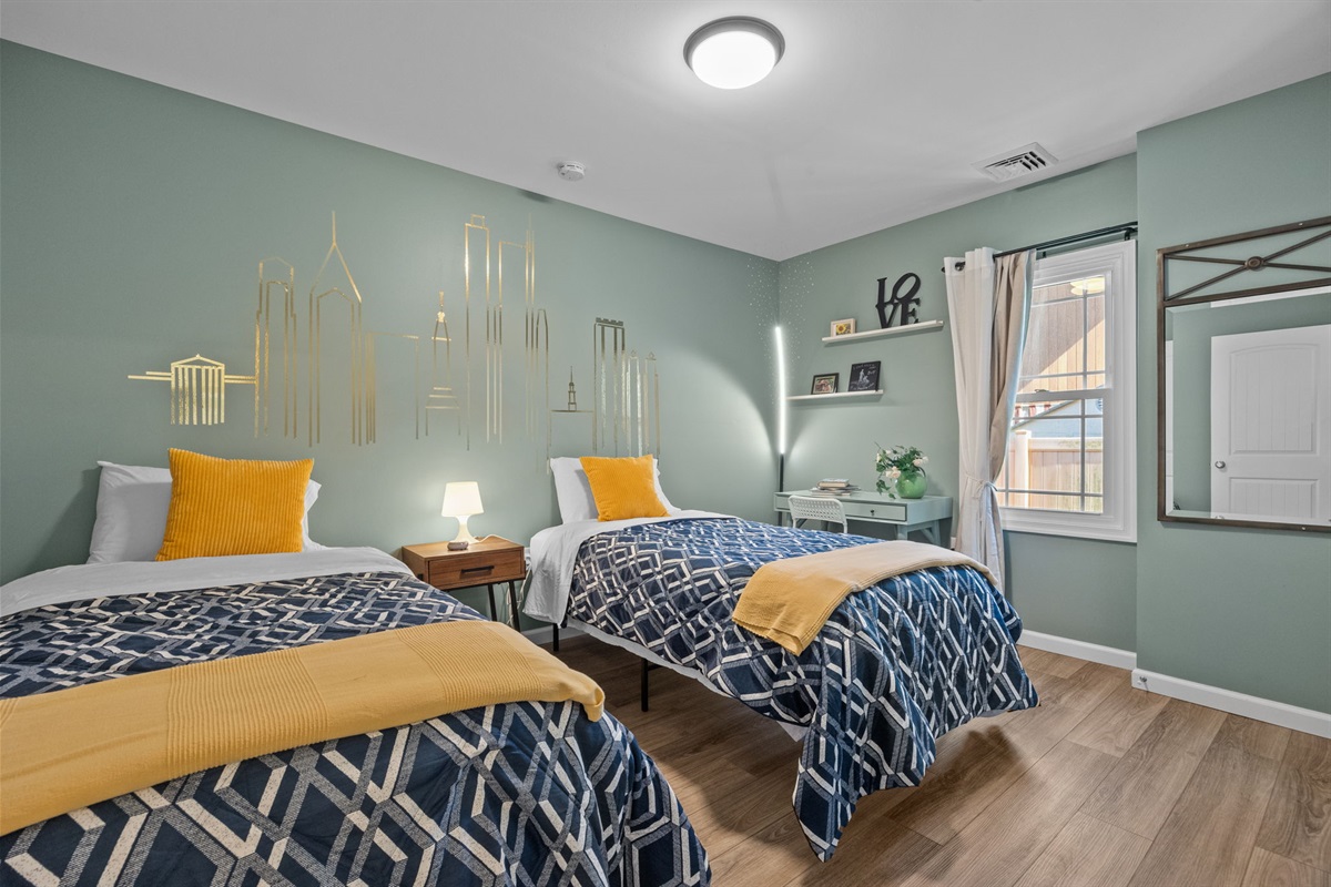 Perfect for the kids or friends, this bedroom features two cozy twin beds