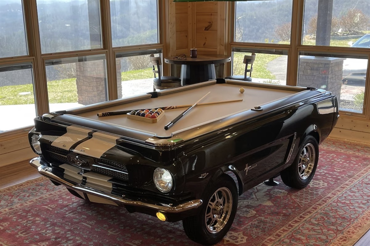 The first thing you'll see upon entering the Chalet is our custom Ford Mustang billiards table.
