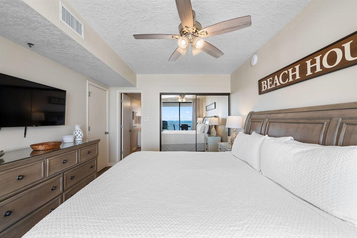 Master bedroom with ensuite Master Bath, upscale furniture, dresser, TV, lots of closet space.