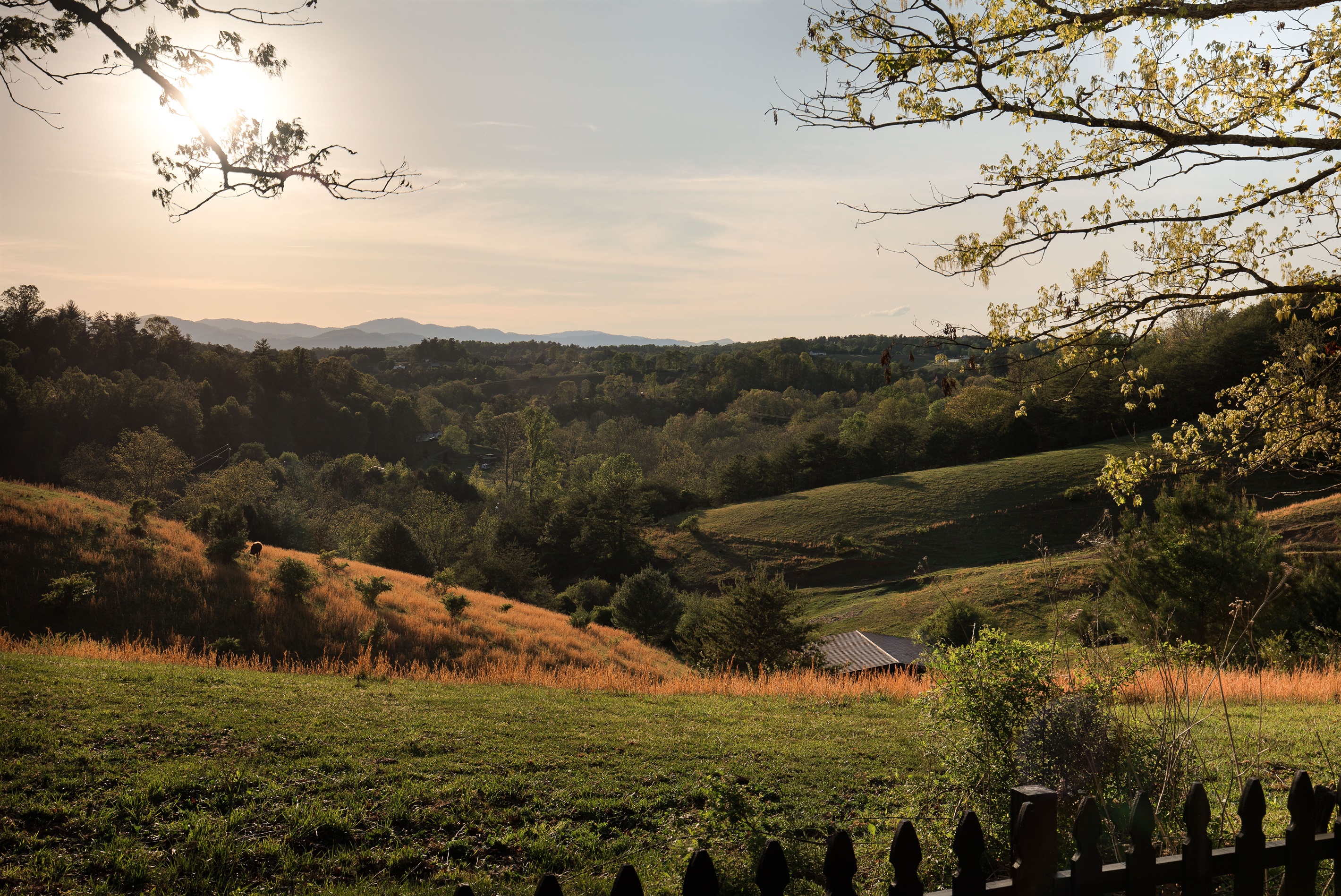 {Panoramic Views} Take in miles of rolling farmland and mountain foothills from one of the most serene settings in the Asheville area.