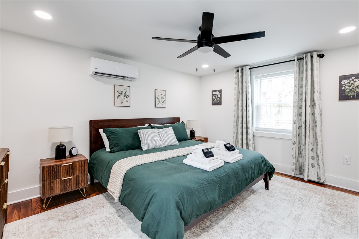 Serene Retreat: Enjoy a queen bed, stylish decor, and natural light in this tranquil bedroom!