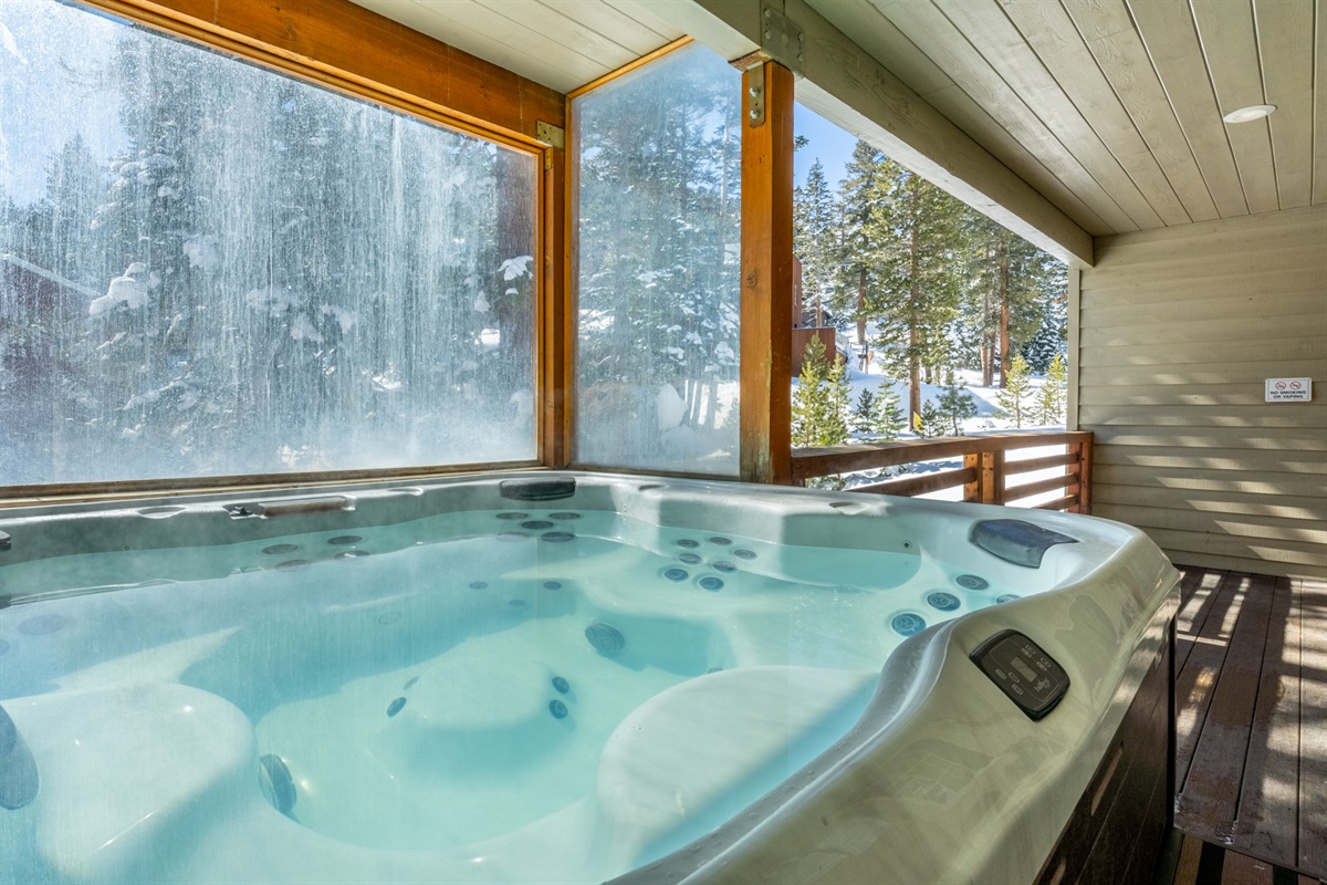 Semi-private hot tub located just outside the unit, shared with one neighboring condo—ideal for après-ski relaxation.