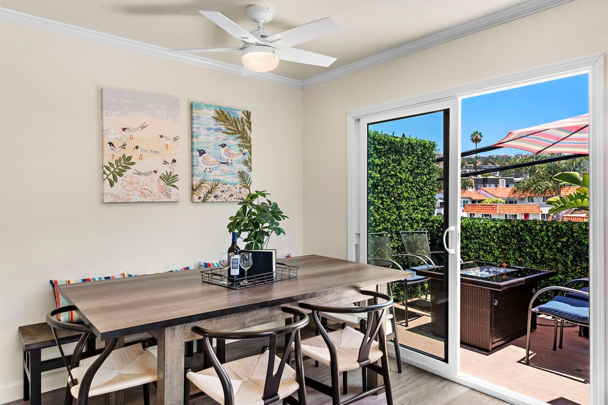 Just outside the kitchen slider is a private balcony deck with outdoor seating.