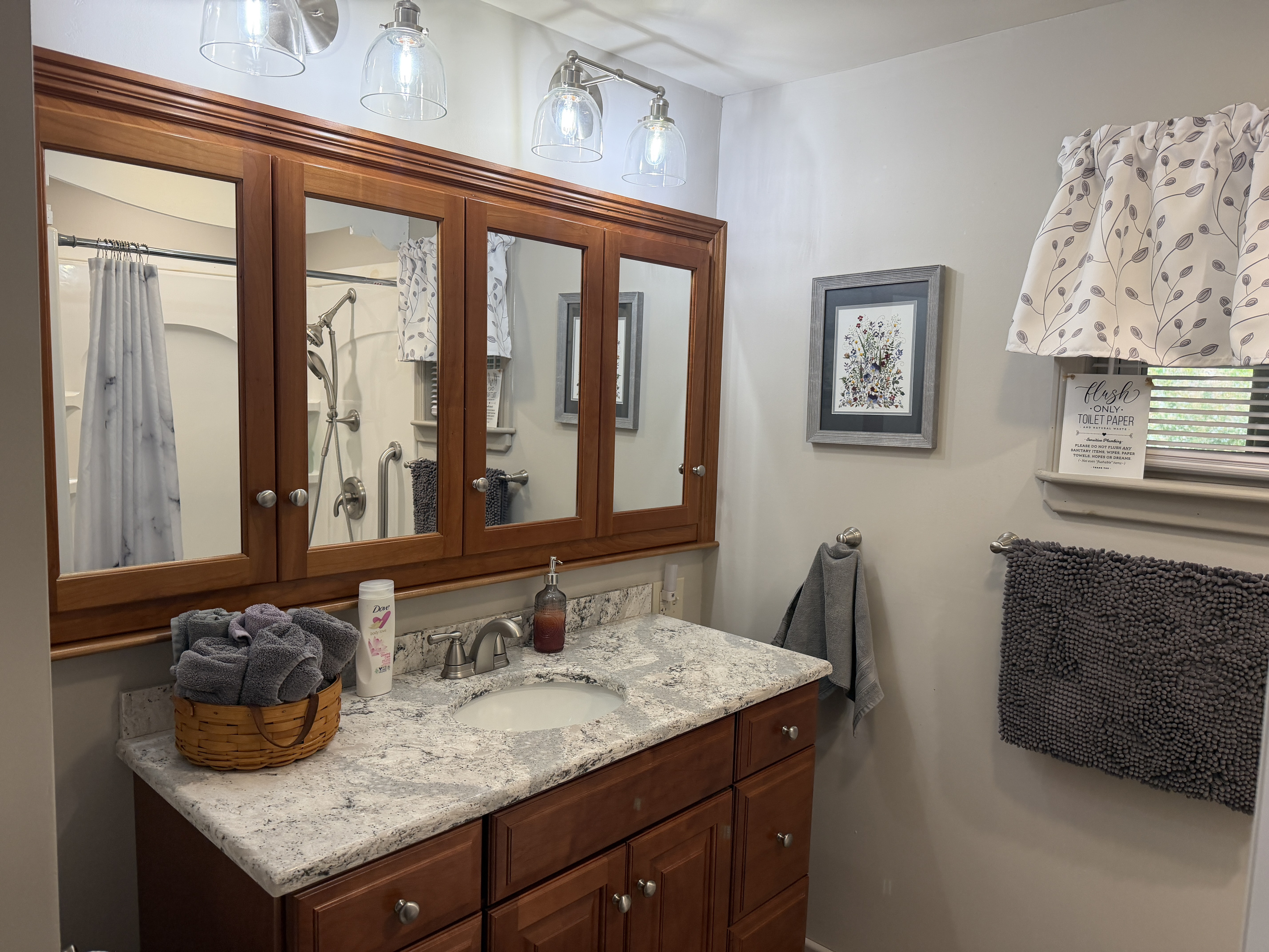 Main level bathroom off hallway w/ shower
