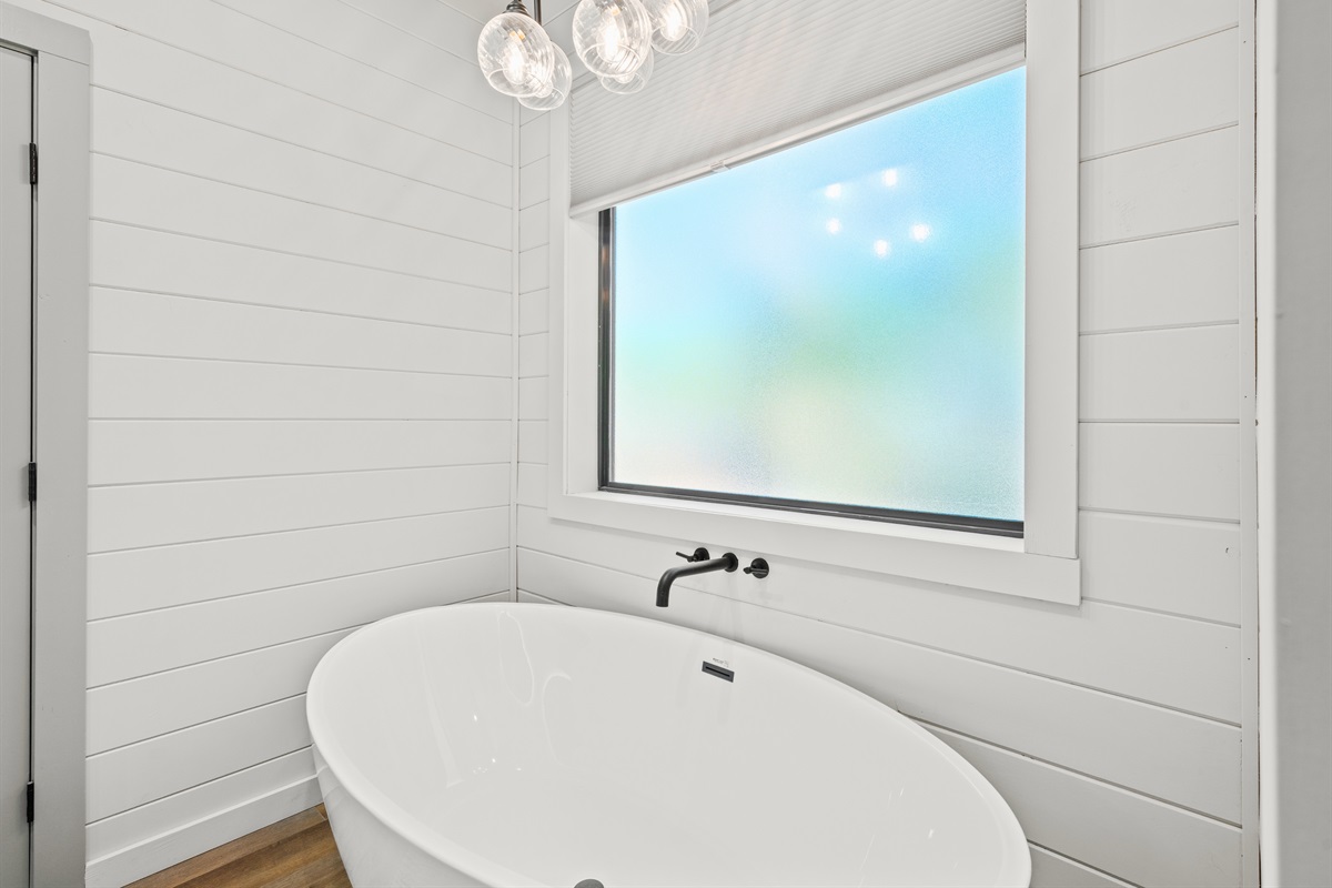 Take a moment for yourself with a soothing soak in the deep freestanding tub—a little luxury you’ll love during your stay.