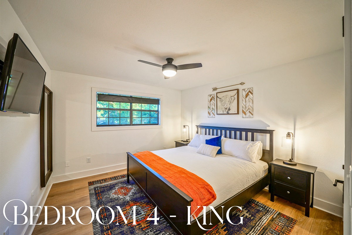 This king suite combines comfort and charm, with bold accents, soft linens, and plenty of space to spread out.