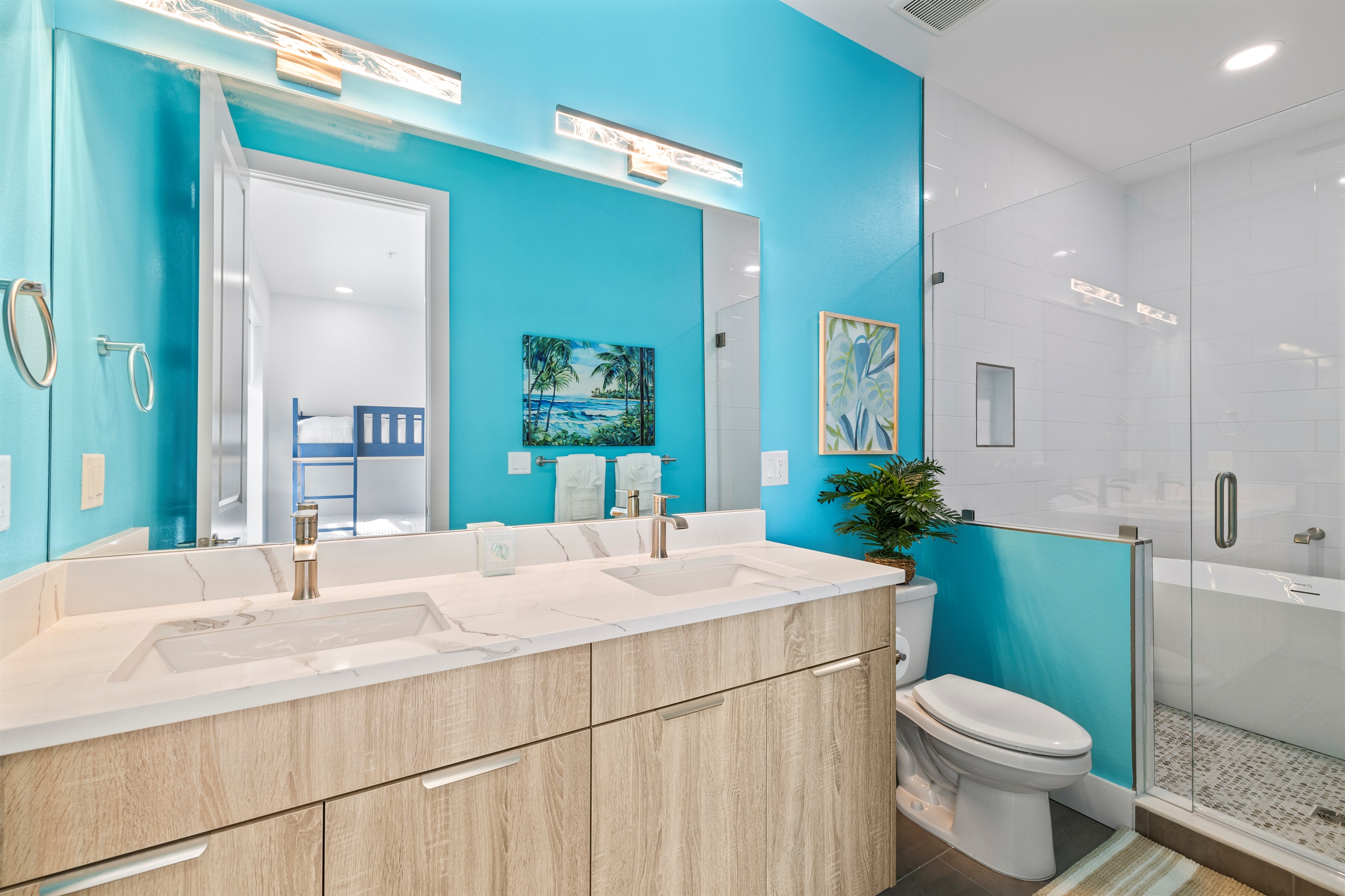 Bunkroom private bathroom with bathtub and shower