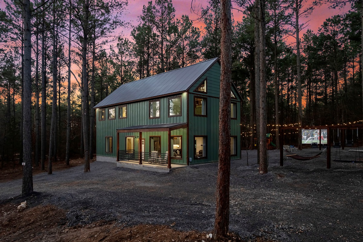 Twilight views surrounded by towering pines + string lights ✨🌲