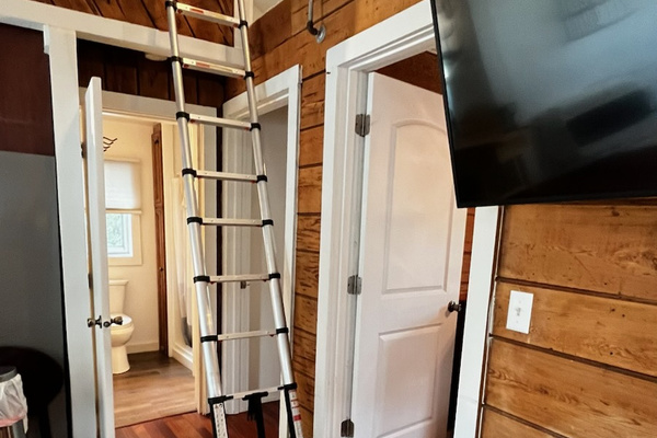 Telescopic ladder leads up to the loft. The ladder can be left up or taken down.