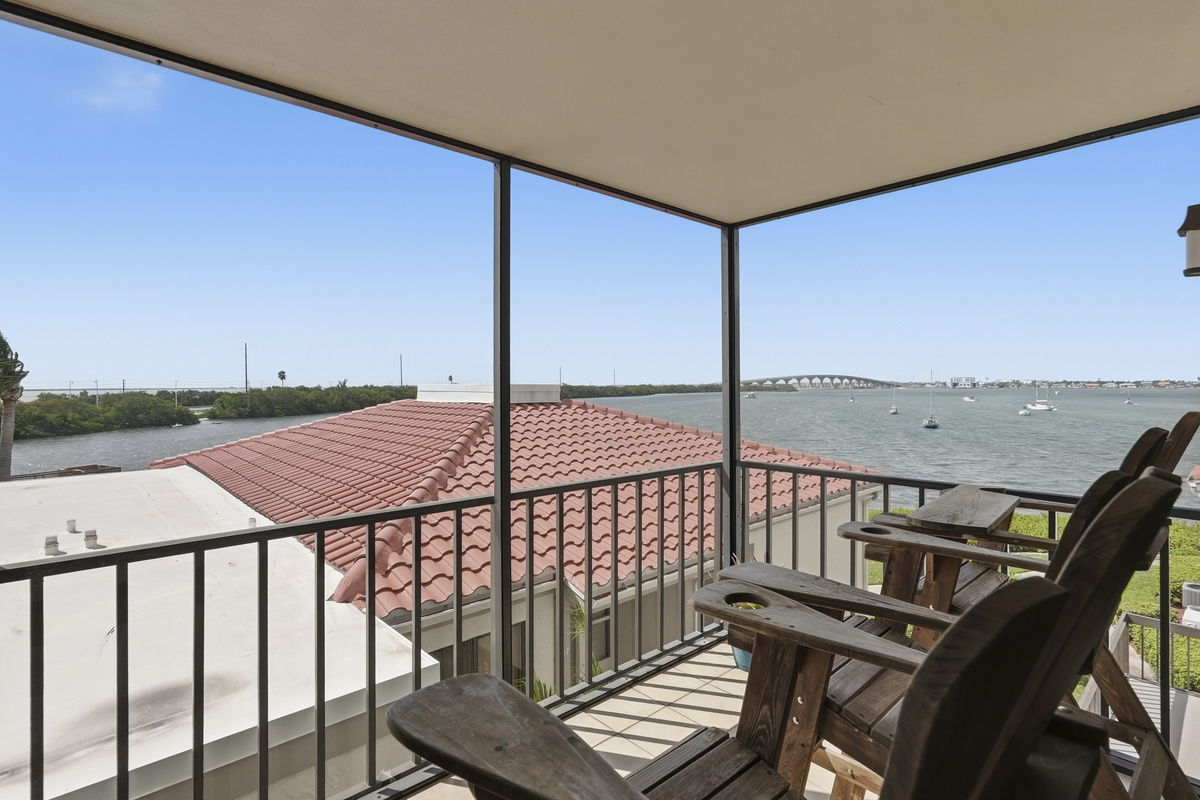 Step onto the screened-in balcony and take in peaceful waterfront views—an ideal spot for morning coffee, an evening unwind, or simply enjoying the gentle Florida breeze.