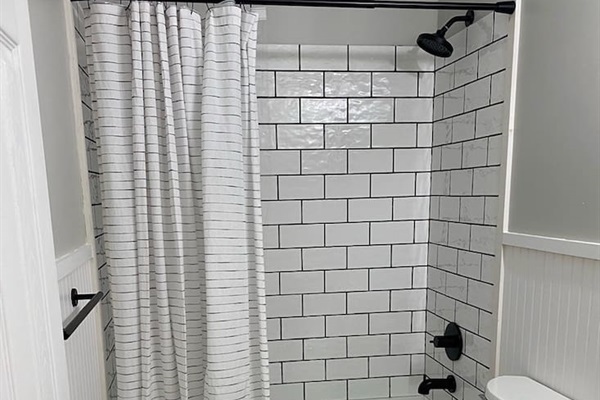 Beautiful tiled bathroom. 