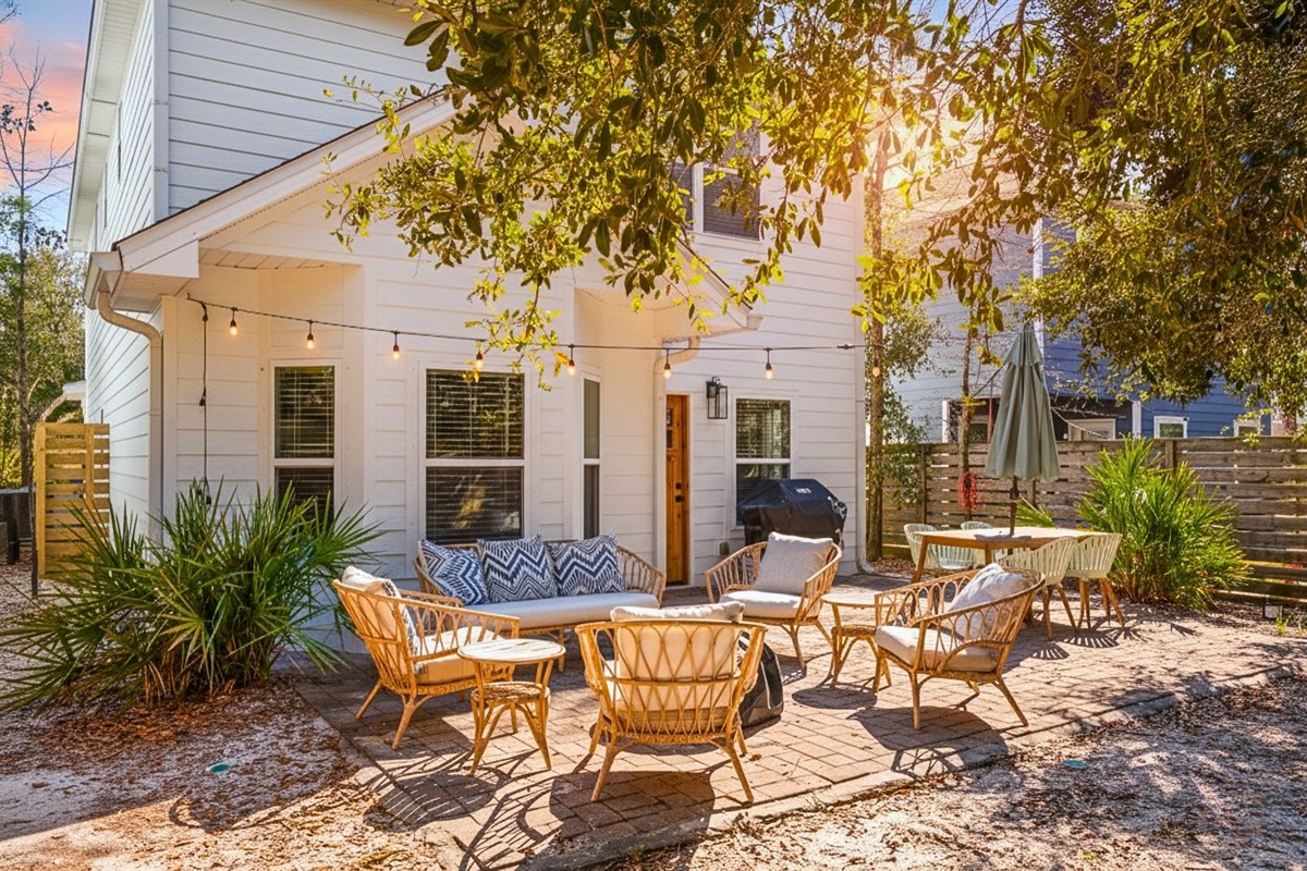 Patio: Relax in your private, fully fenced oasis featuring a fire pit and grill.