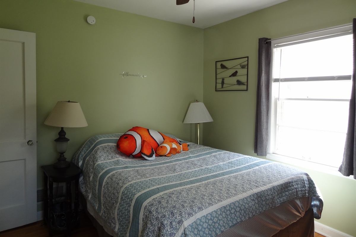 2nd bedroom with queen bed and Roku smart TV