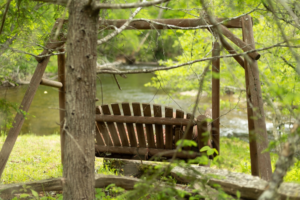 Relax on the swing and take in the scenic junction where Little Snowbird Creek meets Snowbird Creek below.