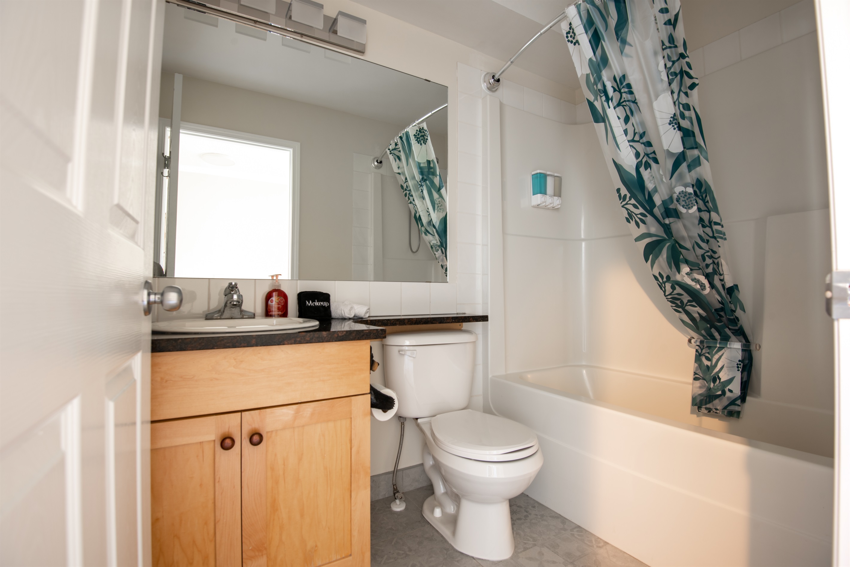 Full bathroom in the hallway.  Towels, shampoo/conditioner and soap provided. Hair dryer.