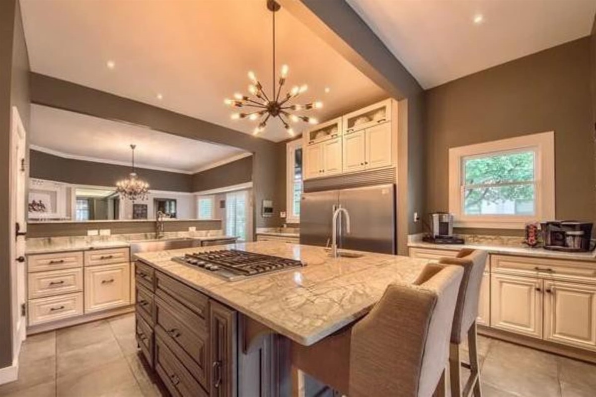 THIS KITCHEN!! Full Size refrigerator and freezer. Coffee bar on one side and wine/bourbon on the other. Room for the entire family. 