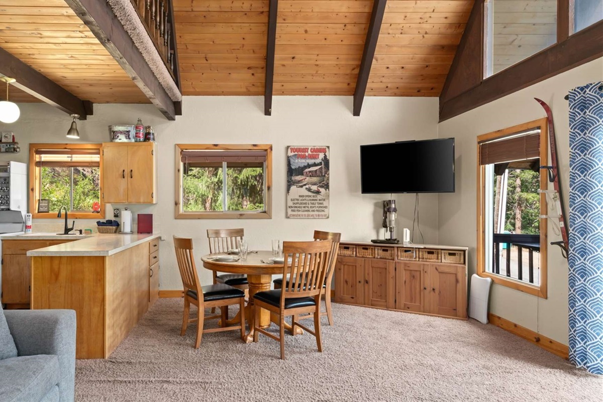 Vaulted ceilings and open-concept layout make the space feel bright and airy.
