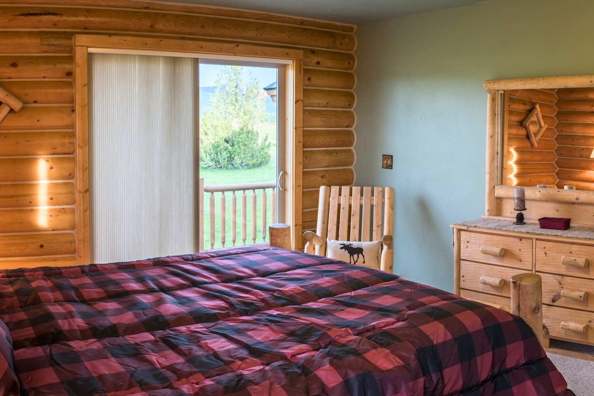 The country-style primary bedroom provides all the comforts that you need.